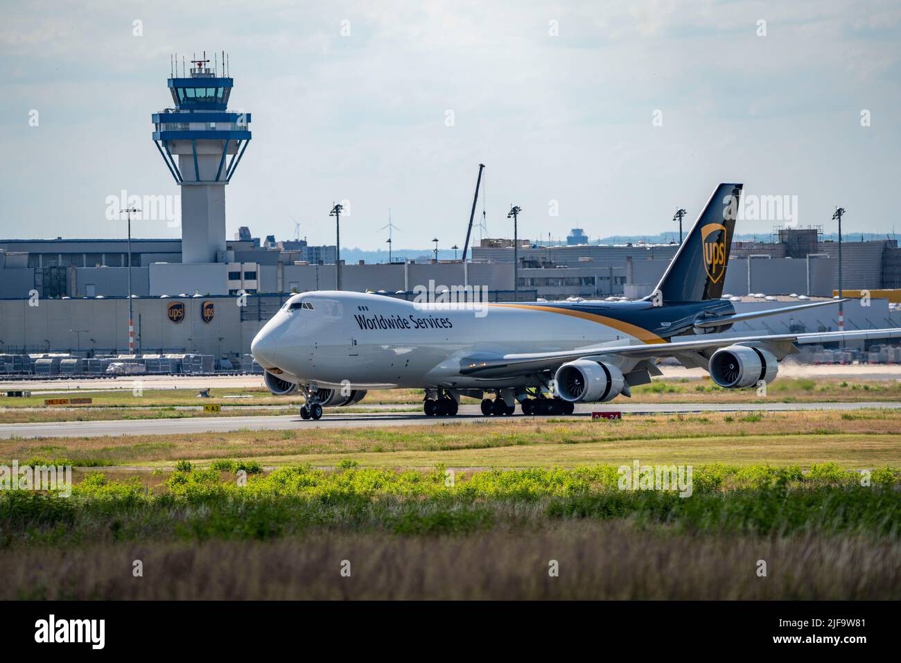 Cologne-Bonn Airport, CGN, UPS cargo aircraft, Boeing 747 jumbo jet, on landing, German Air Traffic Control tower, Cologne, NRW, Germany Stock Photo