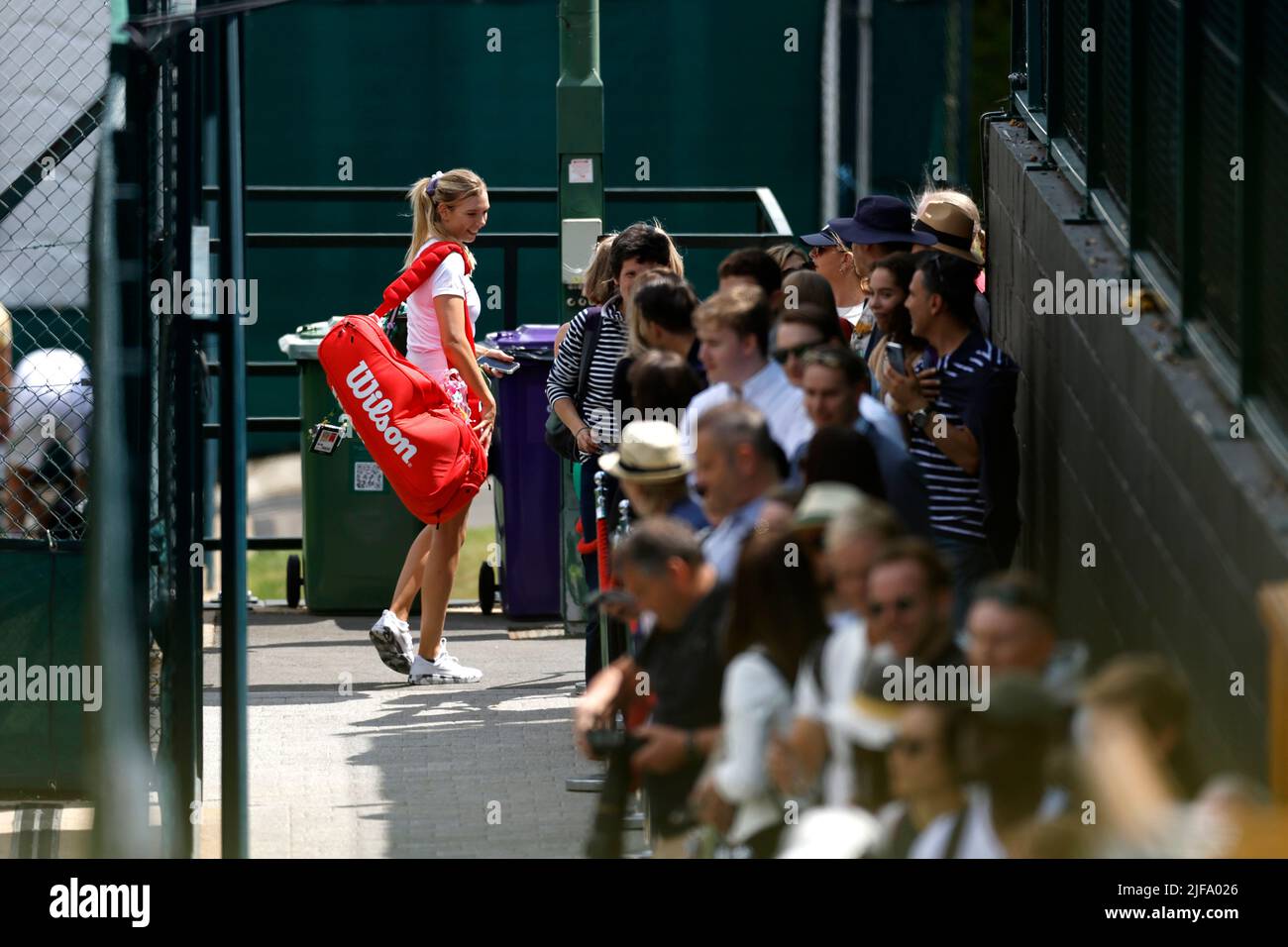 Great Britain's Katie Boulter speaks to spectators on her way to the