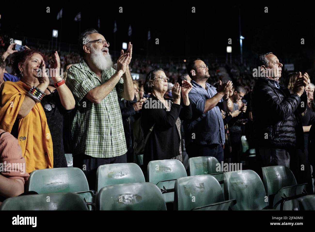 People in a standing ovation at a concert Stock Photo Alamy