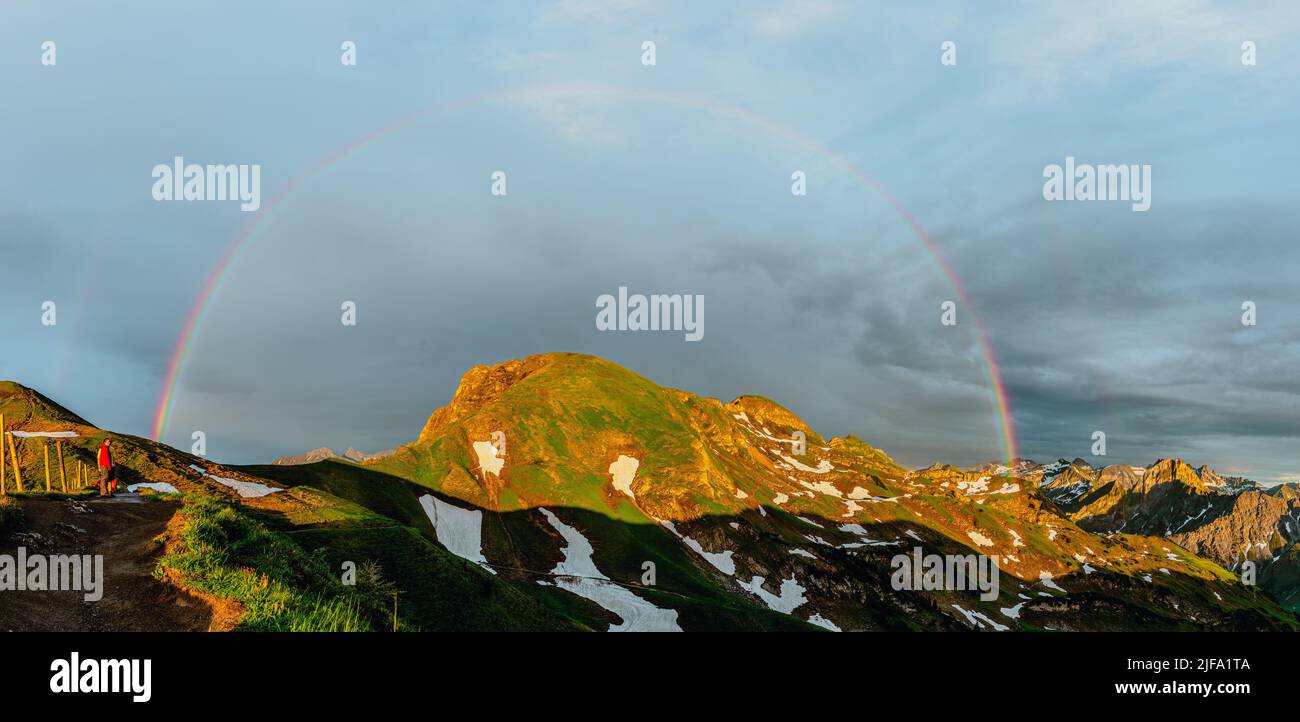 A double rainbow that appears over the mountain after the rain Stock ...