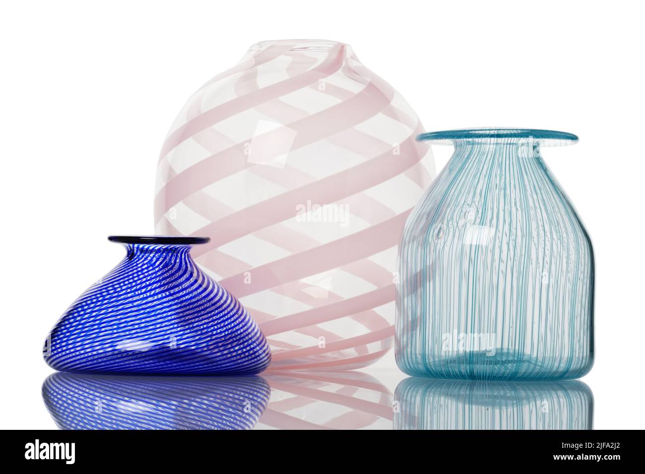 Glassware vase. A group of three small vases against a white background. Stock Photo