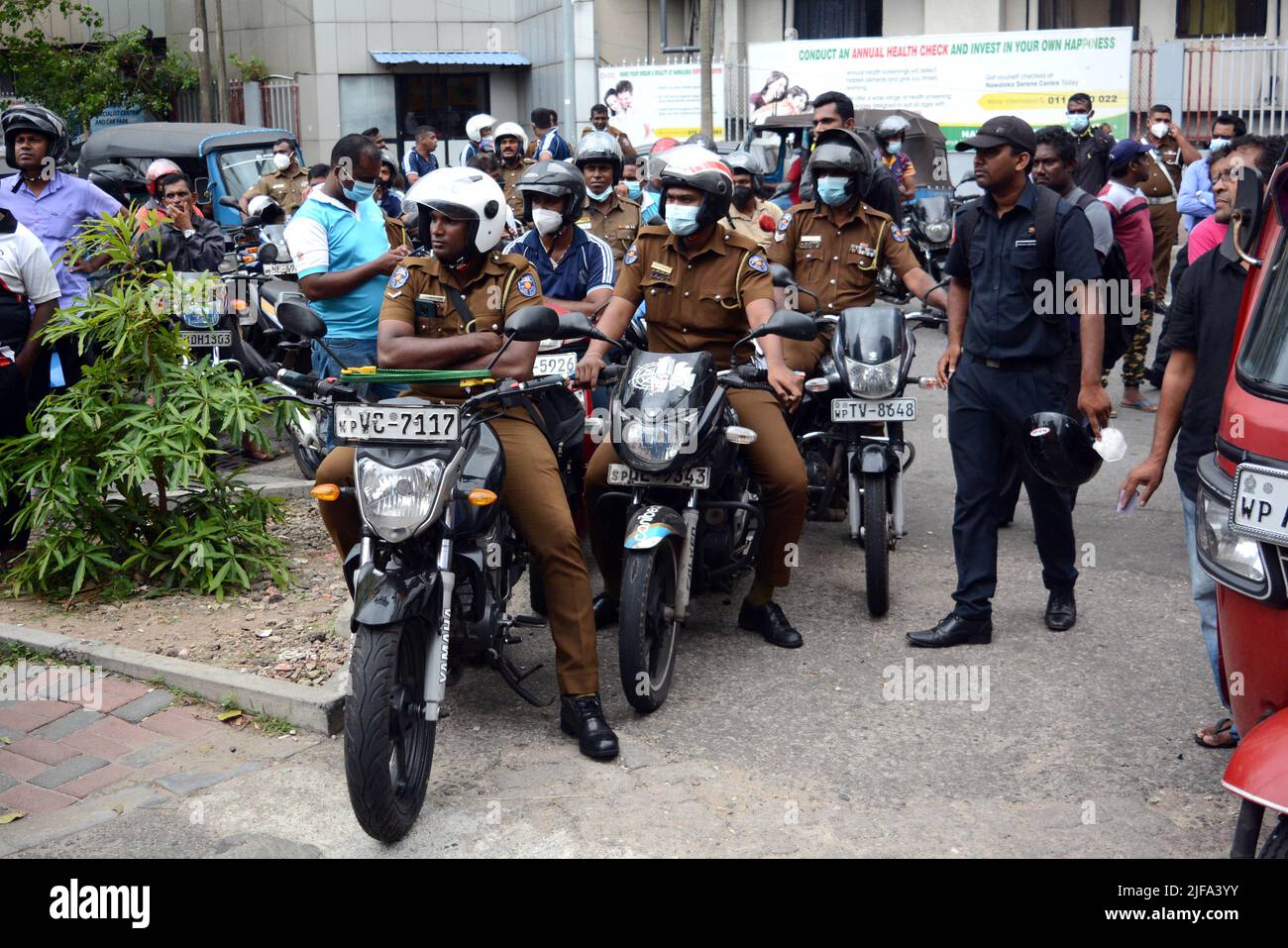 Colombo. 30th June, 2022. Police officers queue up for fuel at a fuel station in Colombo, Sri Lanka on June 30, 2022, as the country has been facing crippling fuel shortages. Credit: Gayan Sameera/Xinhua/Alamy Live News Stock Photo