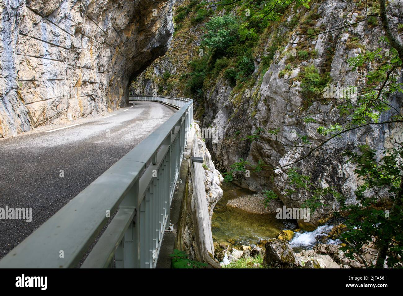 Narrow road through narrow gorge Clue de St Auban with overhanging Narrow road through narrow gorge Clue de St Auban with overhanging