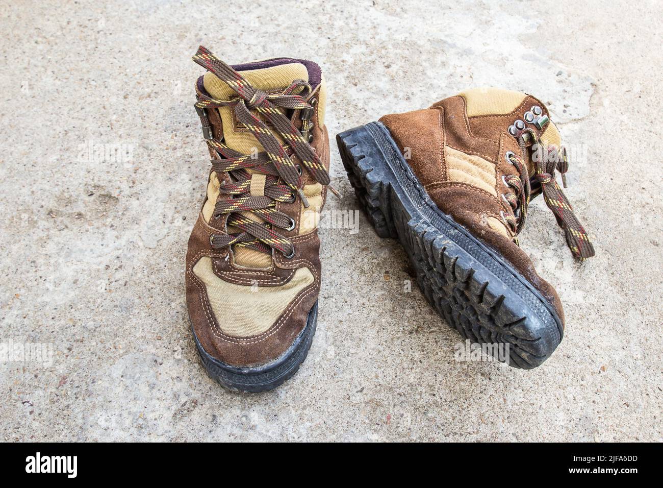 Brown hiking boots on the cement floor Stock Photo Alamy