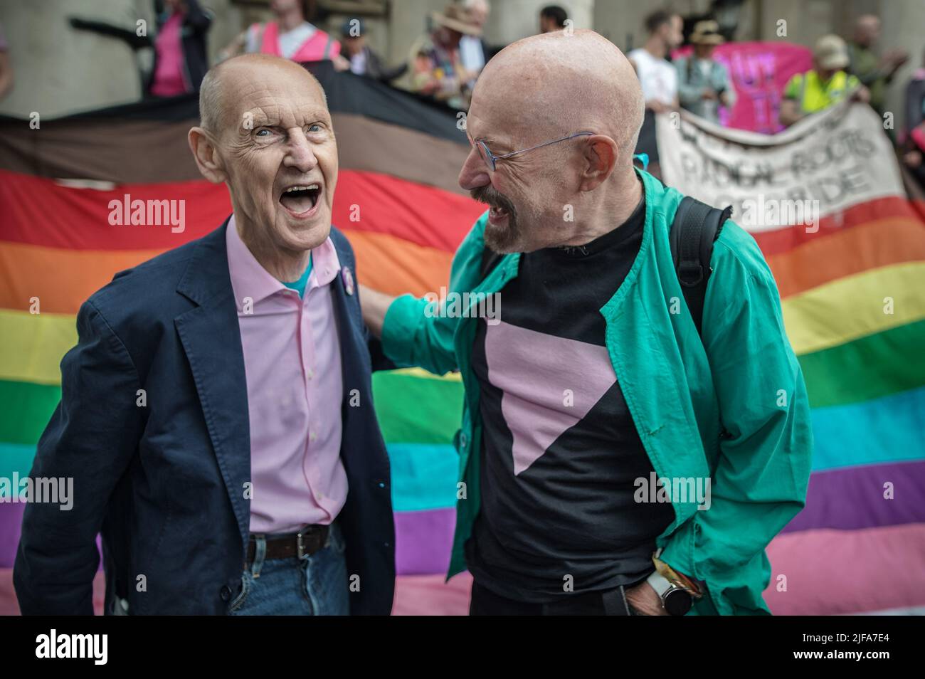 London, UK. 1st July, 2022. UK Pride 50th Anniversary. Led by Gay Liberation Front (GLF) elderly veterans including Stewart Feather (pictured, left) who organised and marched in the first 1972 Pride, the march retraces the exact route taken 50 years ago - Charing Cross and Oxford Street to Hyde Park. This 1972 veterans-led Pride march intends to get back to roots of Pride, being both a celebration and a protest for LGBT rights, with demands for LGBT liberation in the UK and worldwide. Credit: Guy Corbishley/Alamy Live News Stock Photo