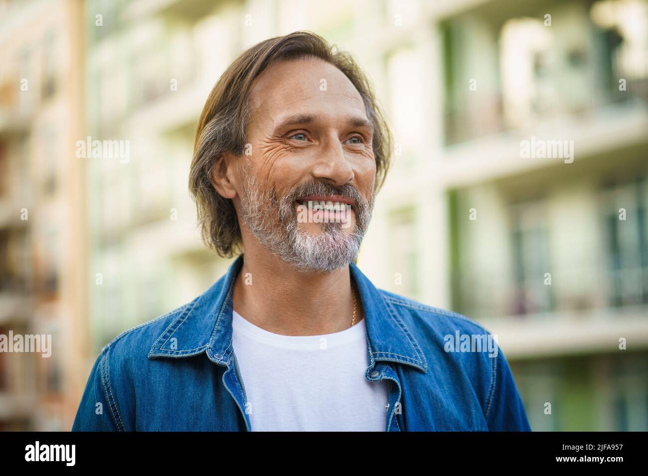 Old man walking phone hi-res stock photography and images - Alamy