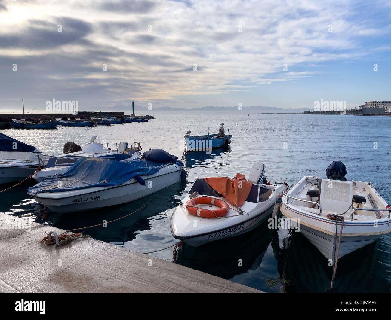 Fishing boats parked in the harbor Stock Photo - Alamy