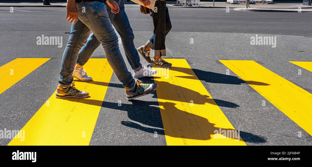 People crossing a pedestrian crossing, Berlin, Germany Stock Photo