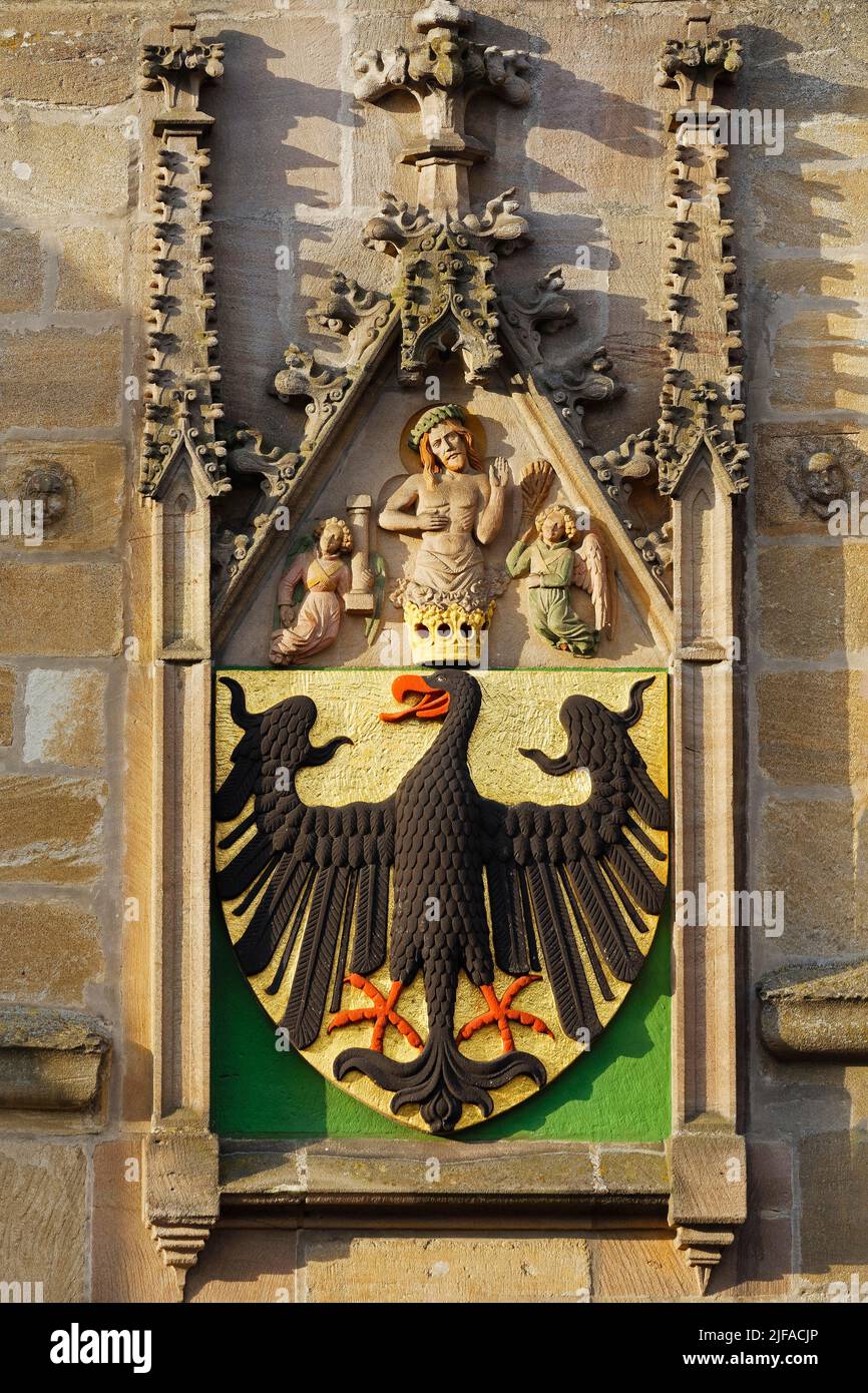 Imperial coat of arms with imperial eagle, patron saint Christ, Man of Sorrows, Ellinger Tor, city gate to the old town in early morning sun, built Stock Photo