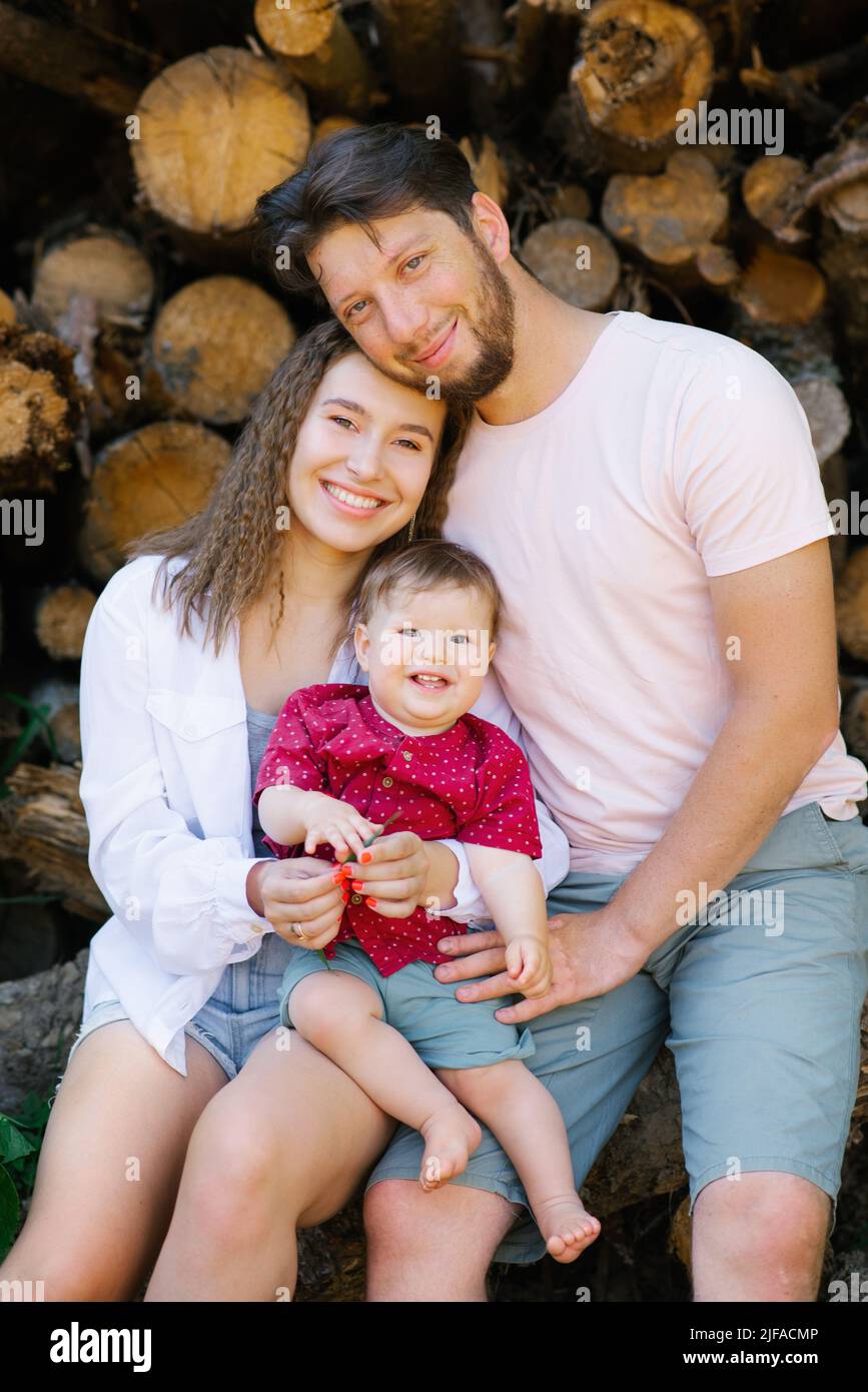 Portrait of a beautiful young happy family. Mom, Dad and baby son Stock ...