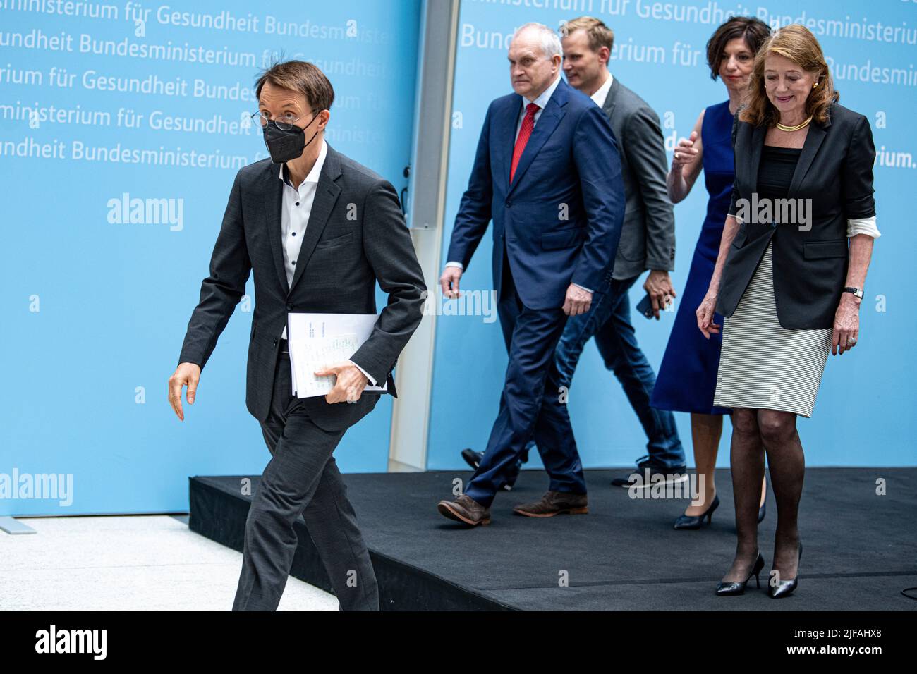 Berlin, Germany. 01st July, 2022. Karl Lauterbach (SPD, l-r), Federal Minister of Health, Christoph Schmidt, President, RWI - Leibniz Institute for Economic Research, Hendrik Streeck, virologist, Jutta Allmendinger, sociologist, and Helga Rübsamen-Schaeff, virologist, chemist and deputy chair of the Expert Committee for the Evaluation of the Infection Protection Act (IfSG), attend a press conference on the IfSG evaluation report. Today, the IfSG presents the results of the evaluation report of the Corona protection measures to date. Credit: Fabian Sommer/dpa/Alamy Live News Stock Photo
