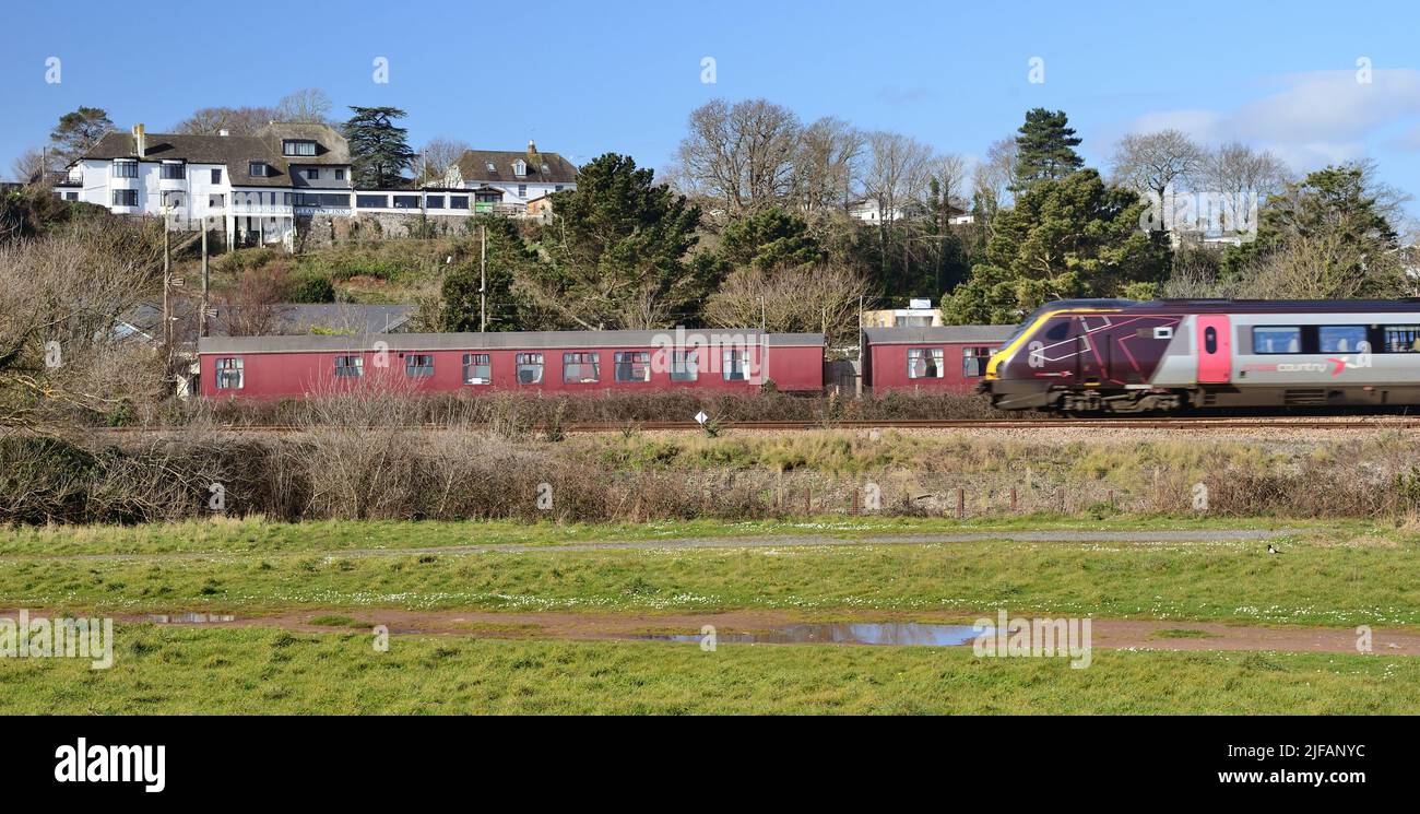 A Cross Country train passing camping coaches at Dawlish Warren, South Devon. Stock Photo