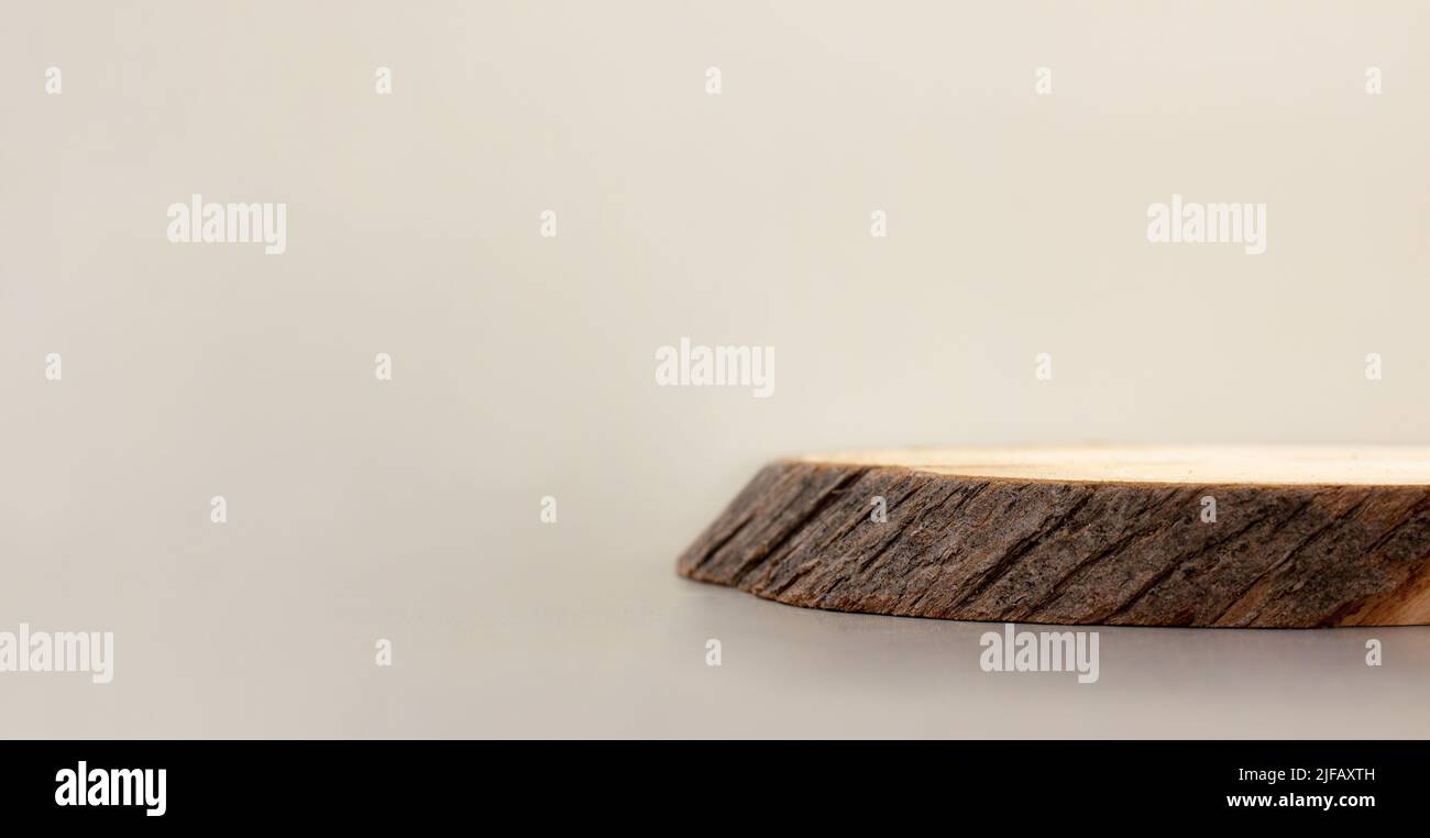 empty piece of wood podium minimalism on beige background. Copy space, place for text, banner Stock Photo
