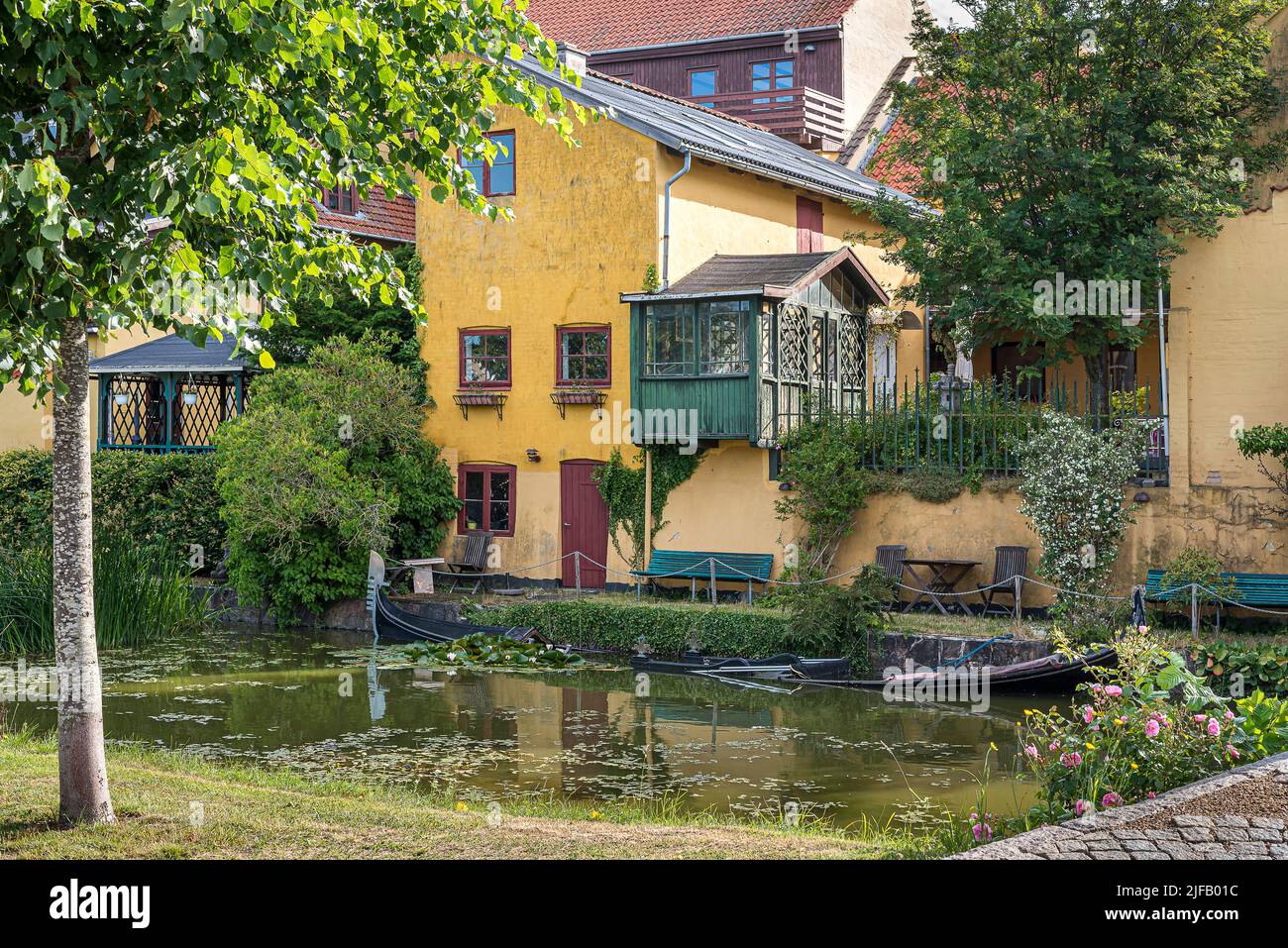 a sunken gondola in a picturesque canal in the town Frederiksværk, Denmark, June 28, 2022 Stock Photo
