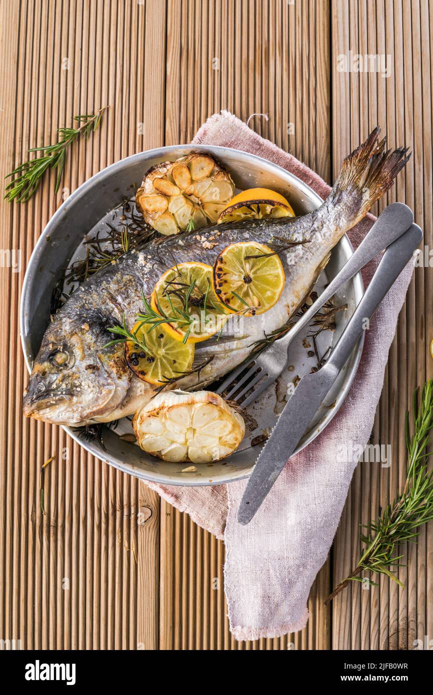 Delicious Grilled dorado fish with lemon and parsley. Whole Bbq sea bream  baked. Dorado grill. Ketogenic, keto or paleo diet lunch, Healthy food  trend Stock Photo - Alamy