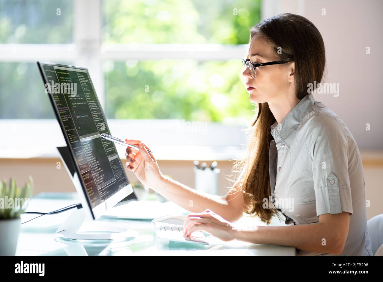 Woman Programmer. Girl Coding Software On Computer Stock Photo - Alamy