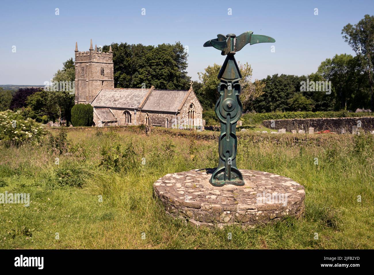 The Granite Way long distance cycle trail, seen at Sourton, Devon, UK. Part of the SUSTRANS national cycle network. To rear St Thomas à Becket church. Stock Photo
