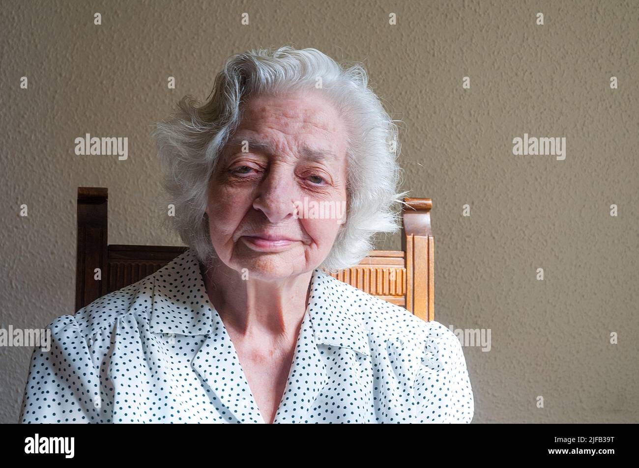 Portrait of old lady looking at the camera. Stock Photo
