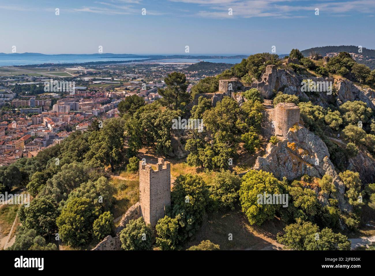 France, Var, Hyeres, Massif des Maurettes, Castéou hill, 11th century Hyeres Castle and the tombolo of the Peninsula of Giens in the background (aerial view) Stock Photo