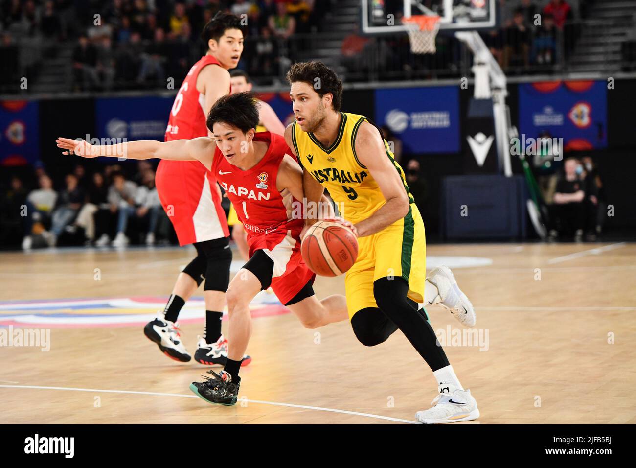 Melbourne, Australia. 1st July, 2022. William McDowell-White (R) of Australia dribbles during a Group B match between Japan and Australia of Basketball World Cup Asian Qualifiers in Melbourne, Australia, July 1, 2022. Credit: Bai Xue/Xinhua/Alamy Live News Stock Photo