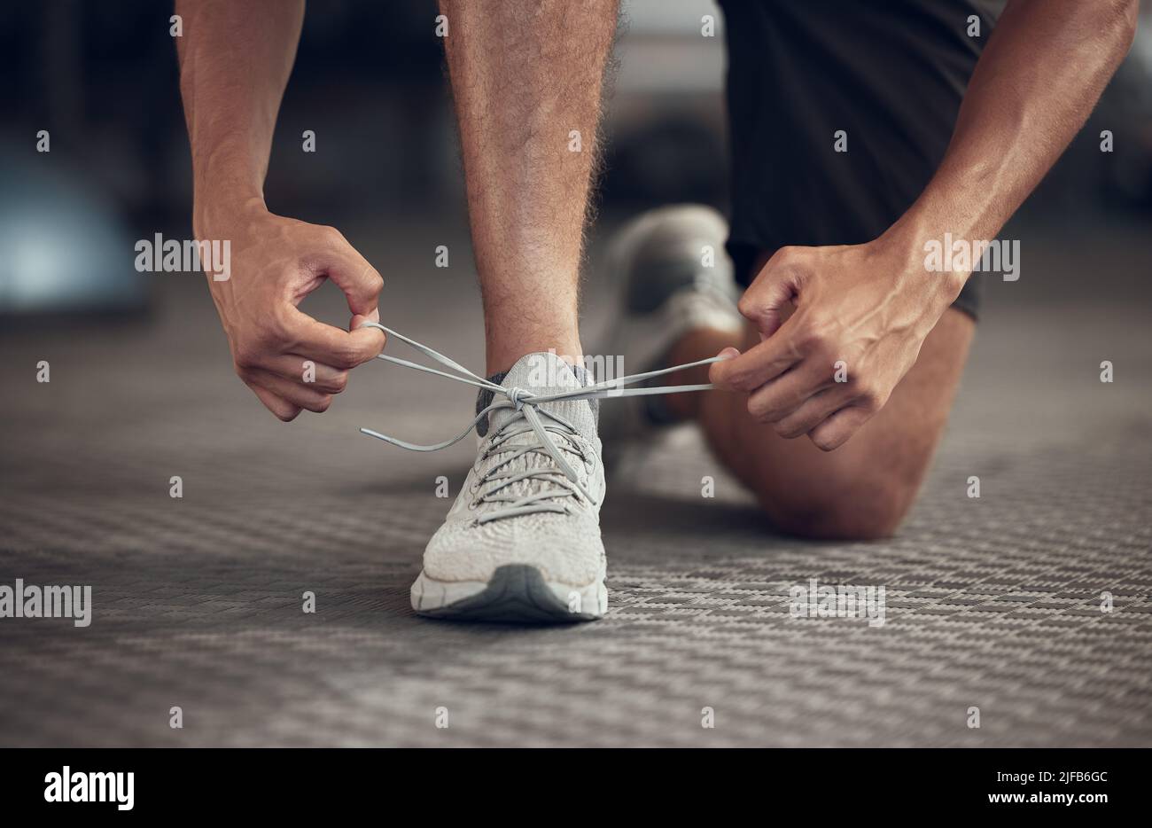 Photo inspiration: Gallery Detail: Closeup Of Athlete Tying His Shoelaces In The Gym Hands