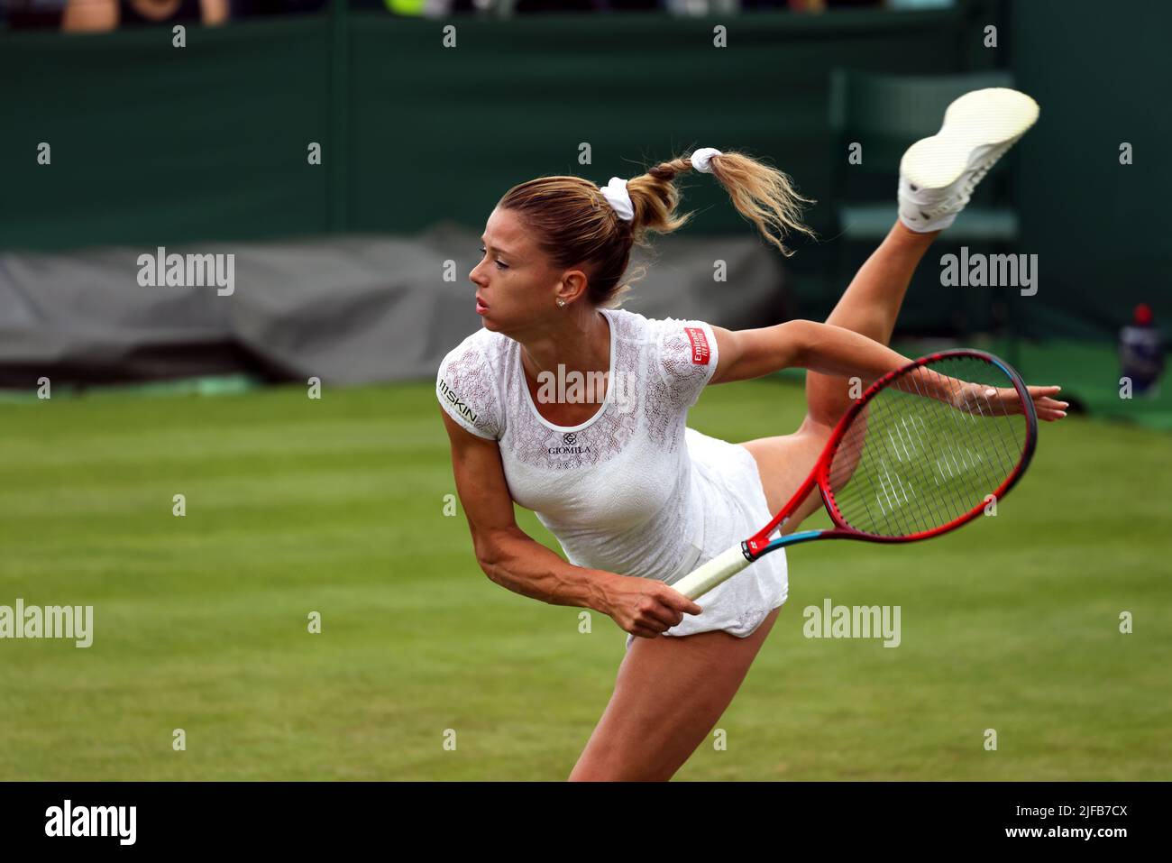 Italy's Camila Giorgi serving to Magdalena Fech of Poland during their  first round match on Tuesday, June 28 at Wimbledon. Giorgi lost the match  in straight sets. Credit: Adam Stoltman/Alamy Live News