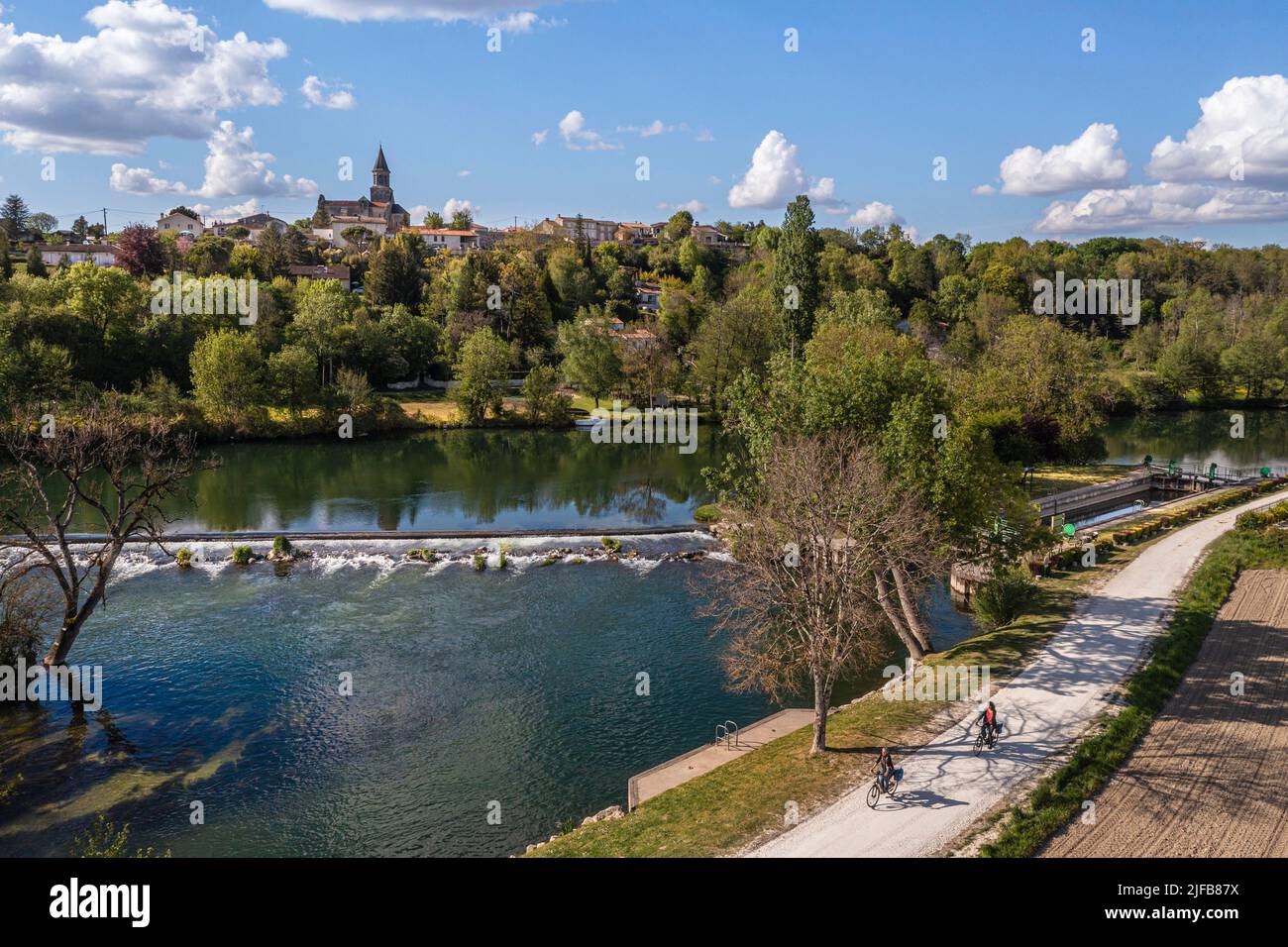 France, Charente, Saint-Simeux, The Charente river bordered by the towpath which has now become the Flow Vélo cycle route, the village and the lock in the background (aerial view) Stock Photo