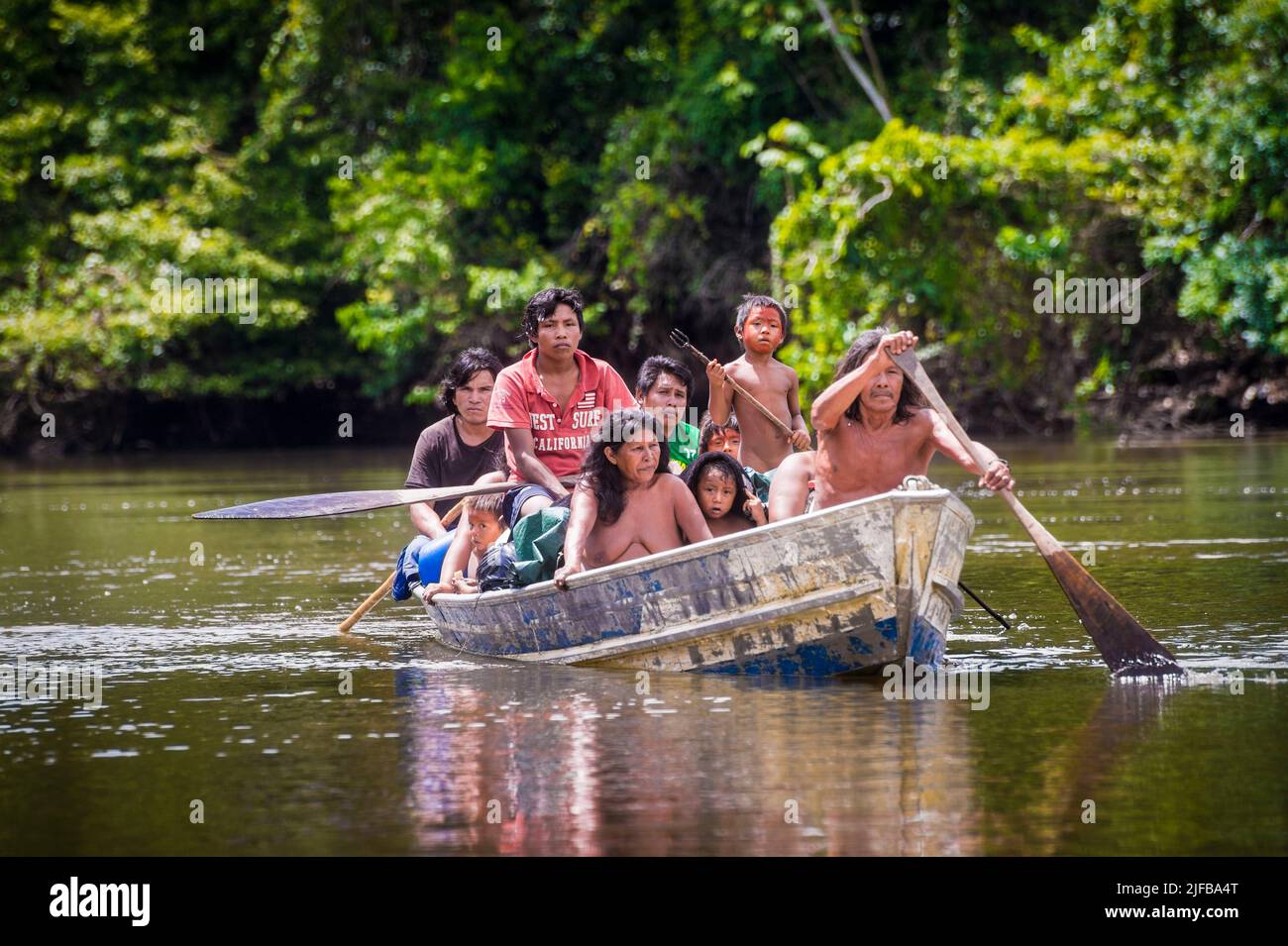 France, French Guiana, Amazonian Park, heart zone, Camopi, Native American family in their boat on the Camopi River Stock Photo