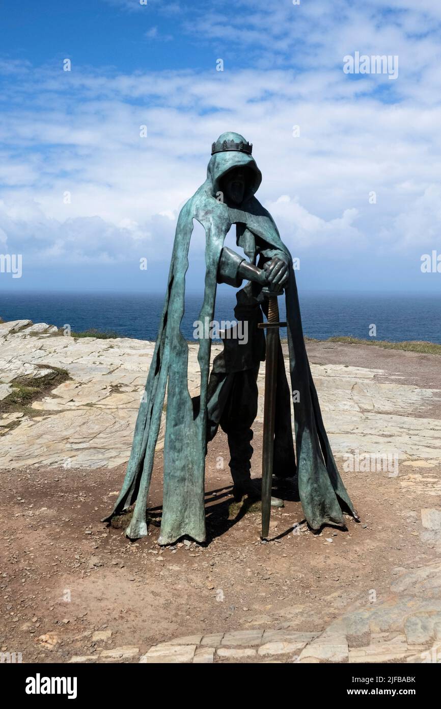 Tintagel, a village on the North Cornwall Coast. Bronze statue of Gallos an ancient king looking over the Castle. Stock Photo