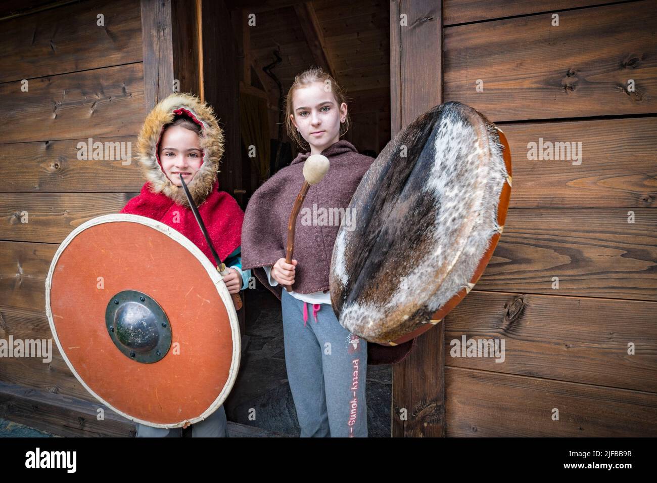Norway, County of Vestland, Naeroyfjord, Aurland, Gudvangen, Viking village, children dressed and adorned as in Viking times, one as a huntress, the other as a shaman Stock Photo