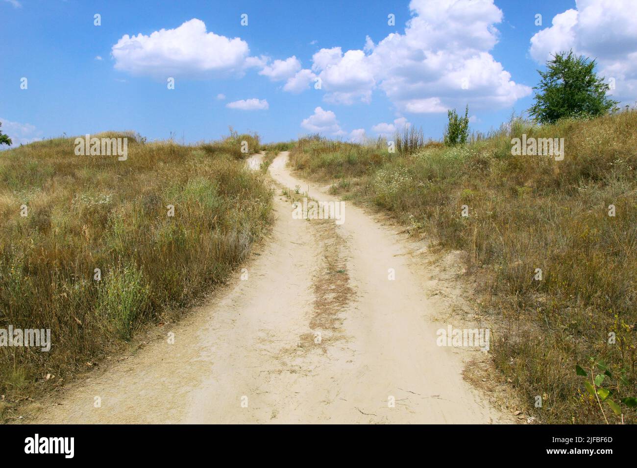 Road leading to the clouds Stock Photo