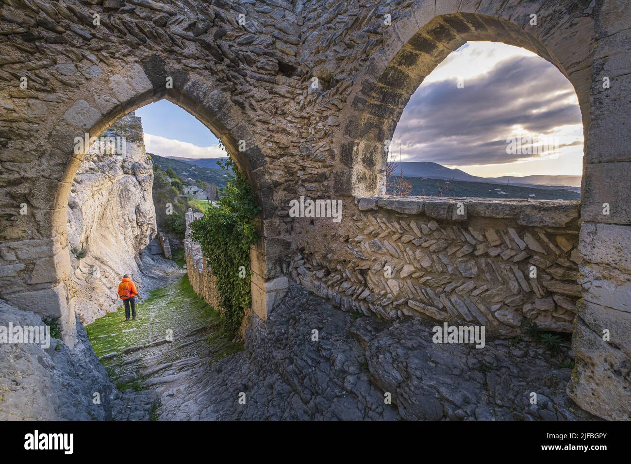 France, Vaucluse, Luberon regional nature park, hike starting from Saint-Saturnin-les-Apt, Gothic door leading to the outer bailey of the medieval castle Stock Photo