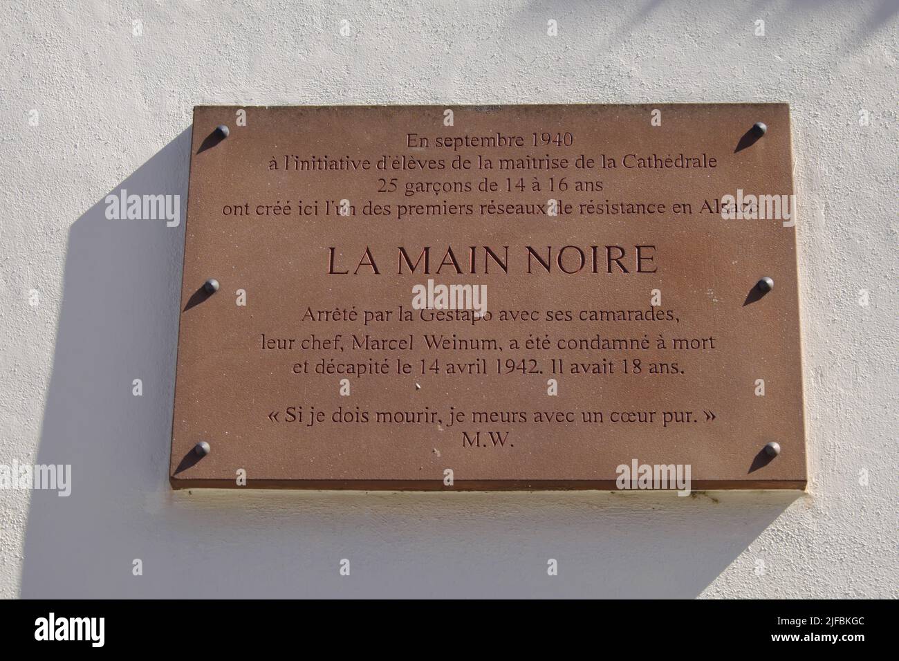 France, Bas Rhin, Strasbourg, old town listed as World Heritage by UNESCO, Place Saint Etienne, Episcopal College Saint Étienne, plaque in tribute to the Main Noire group, a group of young Alsatian resistance fighters Stock Photo