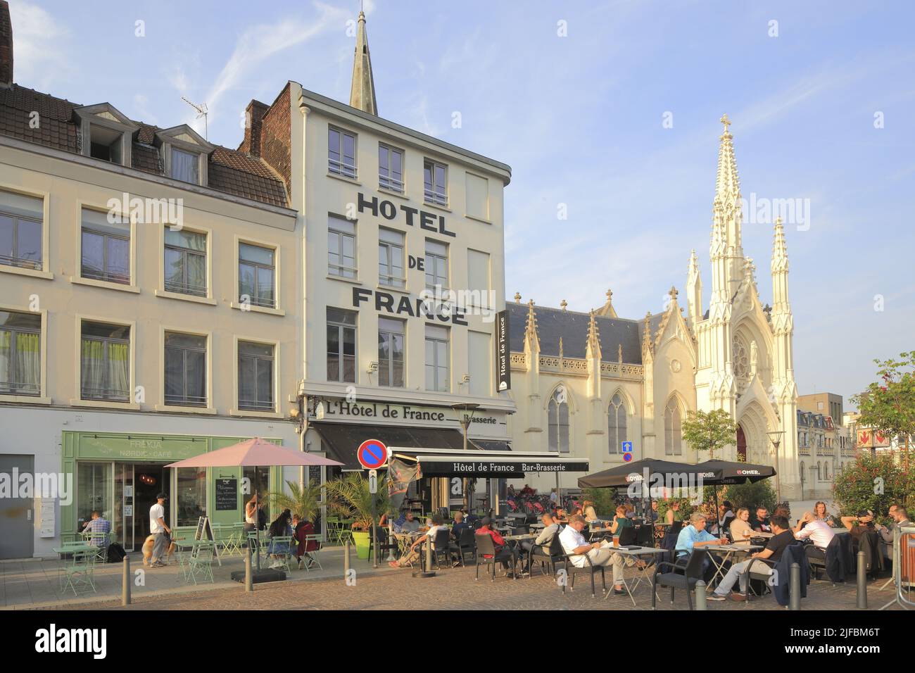 France, Nord, Roubaix, Grand-Place, terrace of the Hôtel de France with the Saint-Martin church in the background (15th century and deeply altered in the middle of the 19th century) Stock Photo