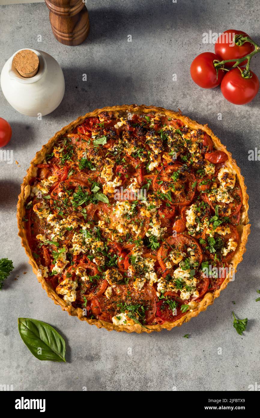 Healthy Homemade Tomato Feta Tart Pastry with Herbs Stock Photo