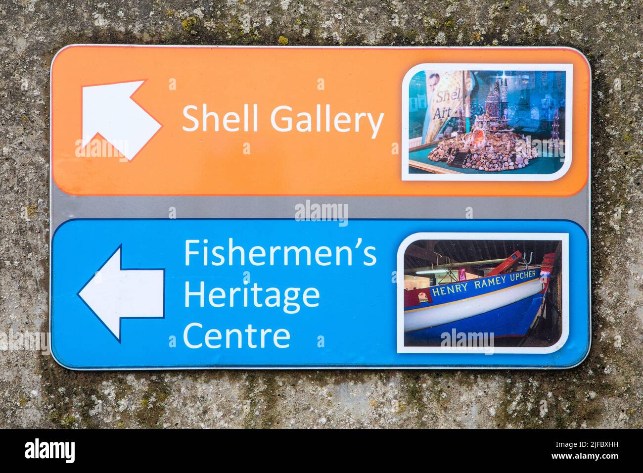 Norfolk, UK - May 16th 2022: Direction signs shoing local tourist attractions- the Shell Gallery and the Fishermens Heritage Centre in the town of She Stock Photo