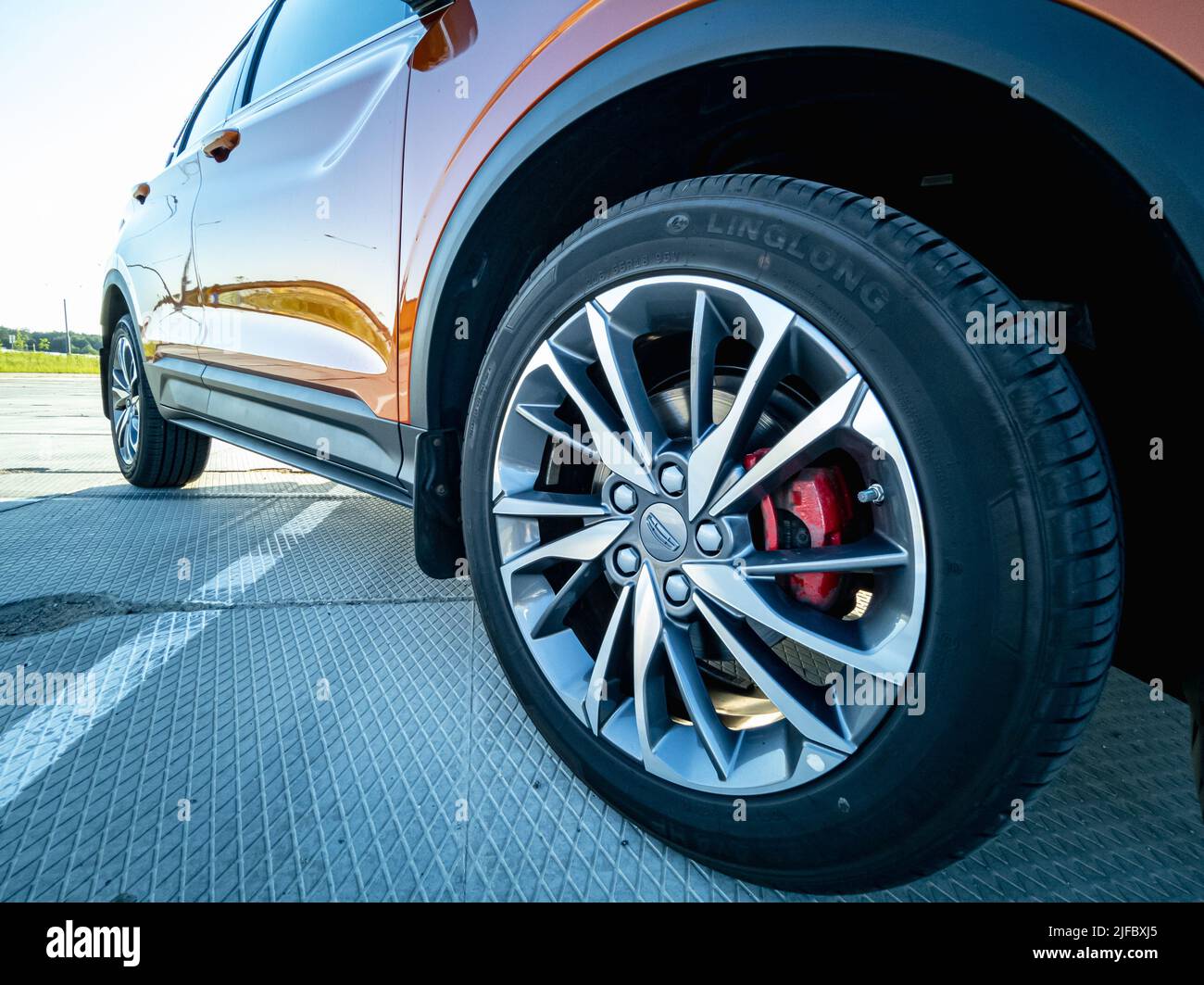 Minsk, Belarus - June 2022: close-up of a Geely Coolray car orange wheel. Stock Photo