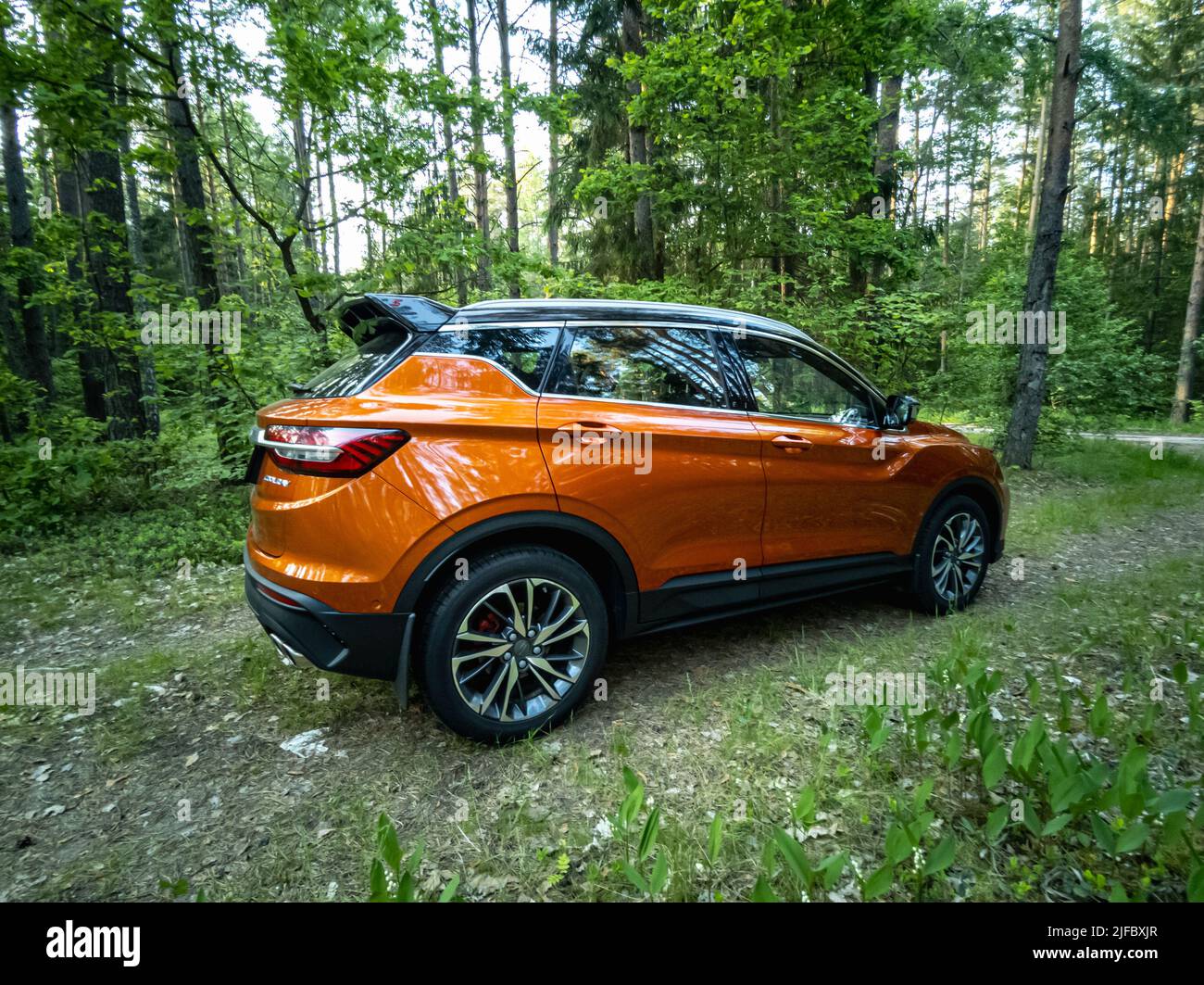 Minsk, Belarus - June 2022: Orange Geely Coolray car. Stock Photo