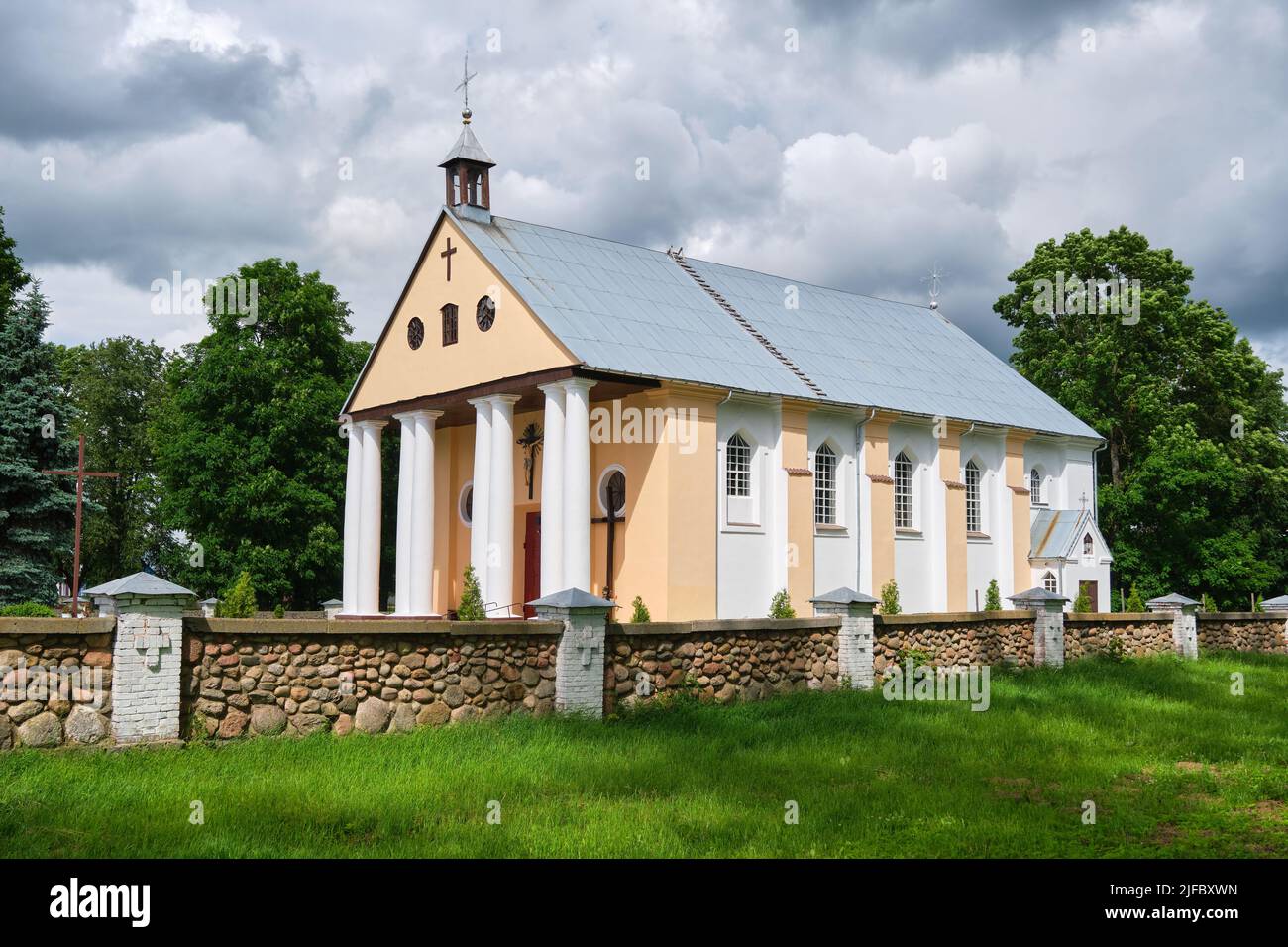 Old ancient catholic church of the Transfiguration of the Lord in classicism style. Malaya Mysh village, Baranovichi district, Brest region, Belarus. Stock Photo