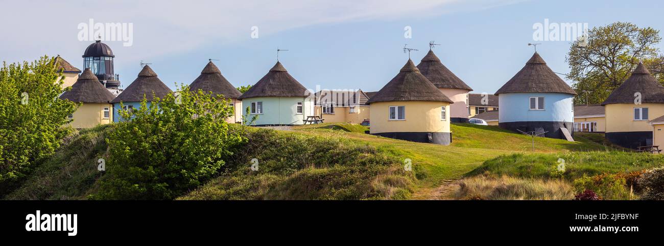 A panoramic view of beautiful thatched Roundhouses in the coastal village of Winterton-on-Sea in Norfolk, UK. Stock Photo
