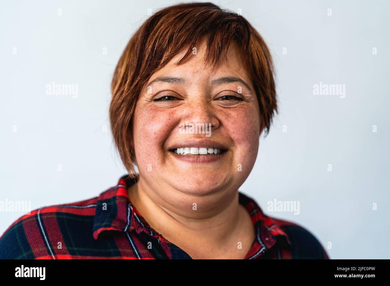 Portrait of curvy mature woman smiling in camera Stock Photo