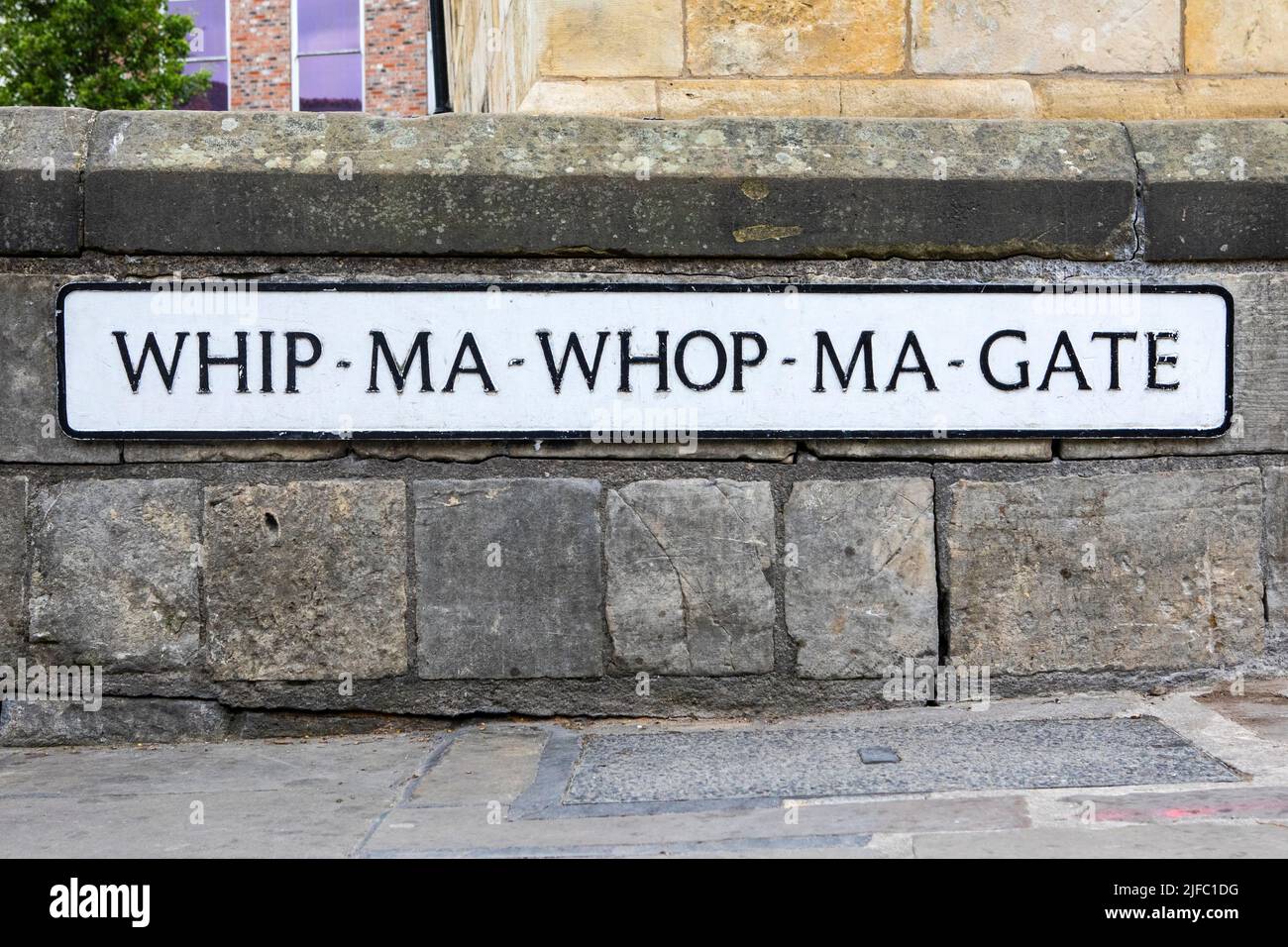 Street sign for Whip-Ma-Whop-Ma-Gate in the city of York, UK. Stock Photo