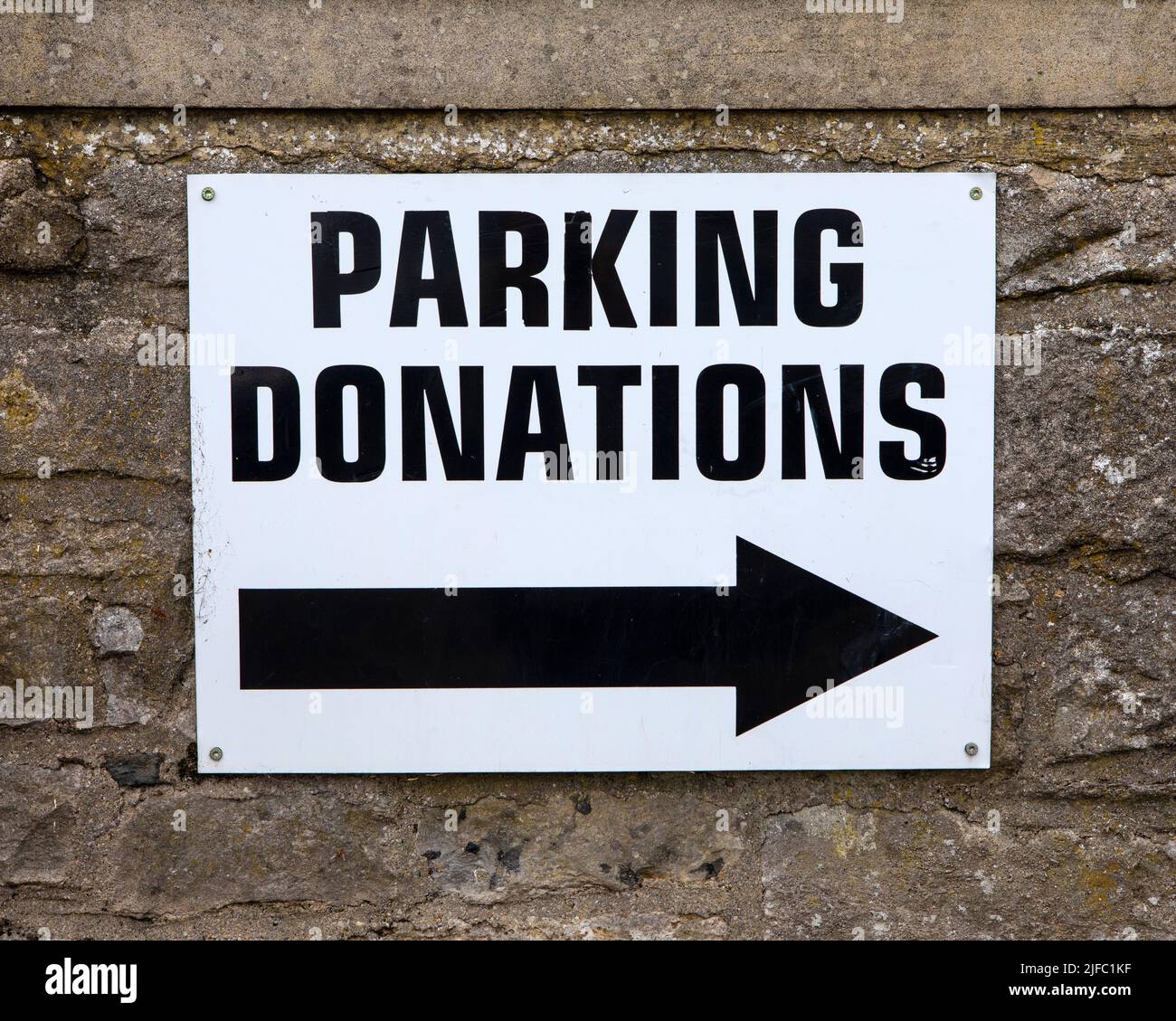 Close-up of a Parking Donations sign in a car park in the market town of Leyburn in North Yorkshire, UK. Stock Photo