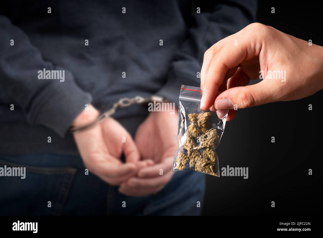 Criminal handcuffed, back view. Criminal arrested, security concept Stock Photo