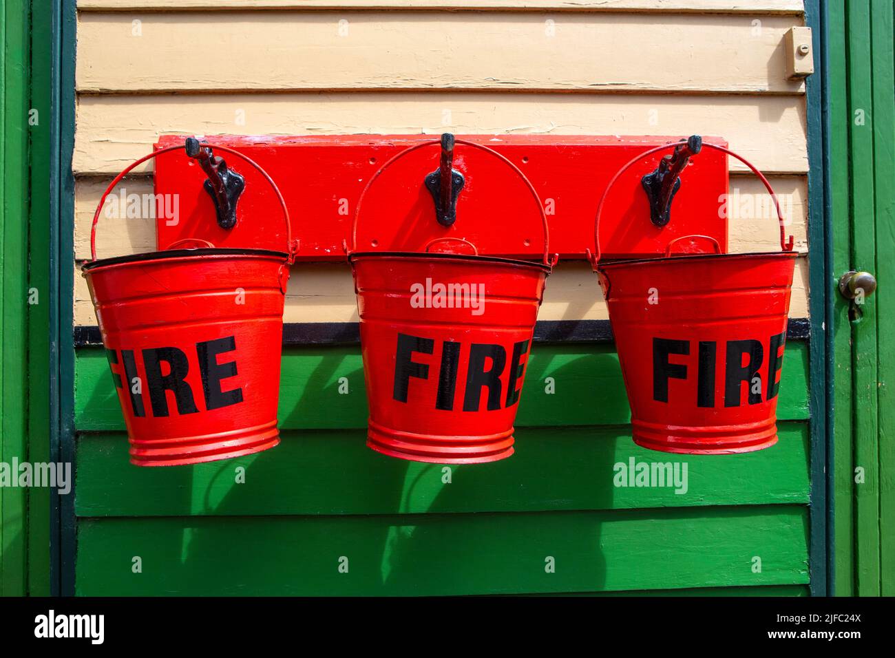 Three vintage fire buckets at Pickering Railway Station in North Yorkshire, UK Stock Photo Alamy