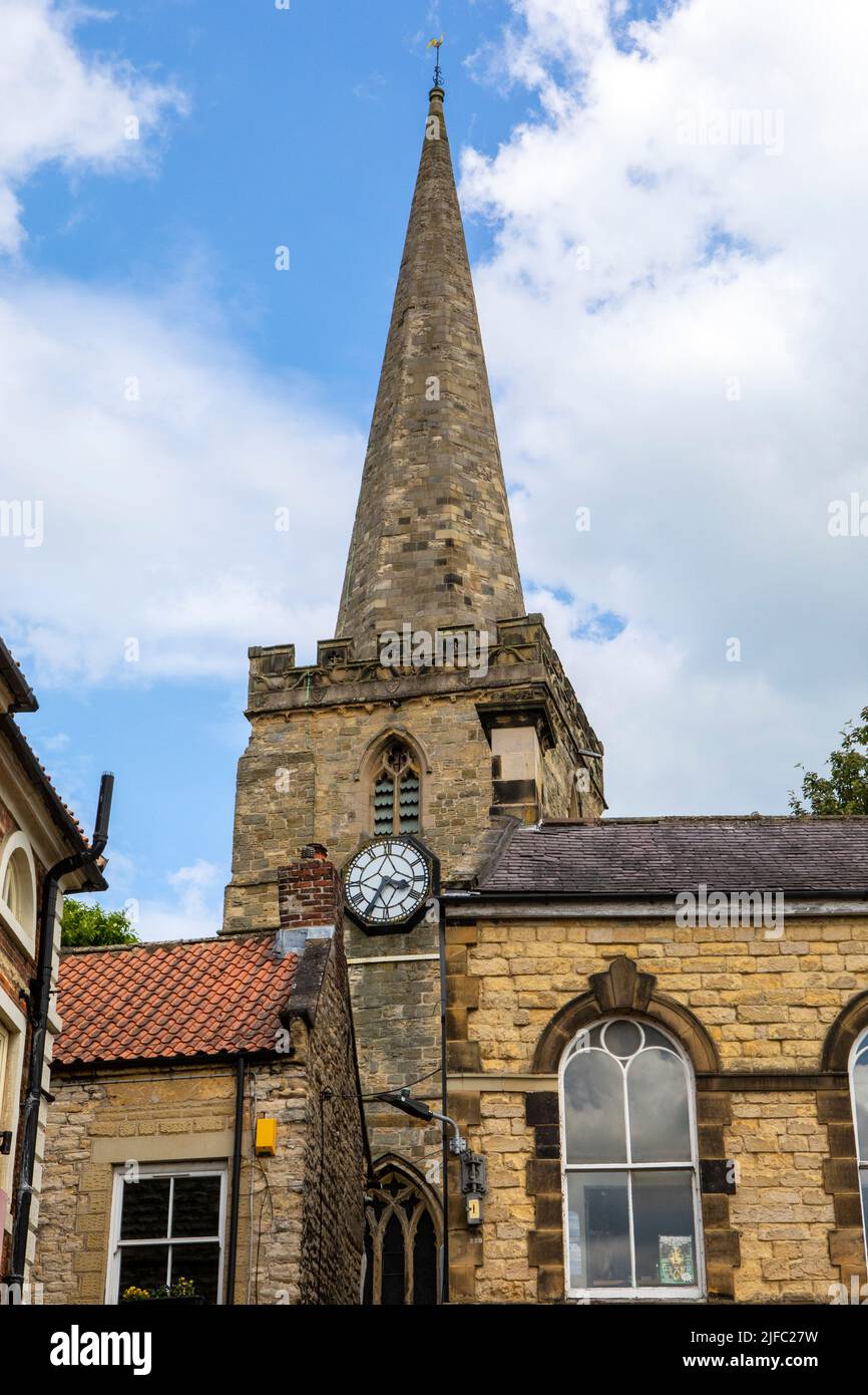 The tower and spire of St. Peter and St. Pauls Church, also known as Pickering Parish Church, in the town of Pickering in North Yorkshire, UK. Stock Photo