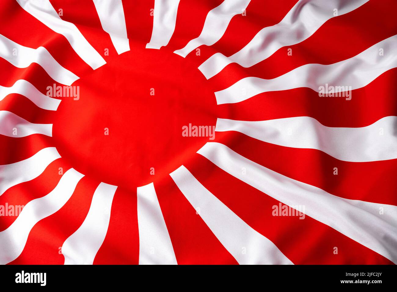 Imperial flag of war world II era Japan with symbolic red rising sun and rays concept for Japanese culture, Asian history and patriotisms backgrounds Stock Photo