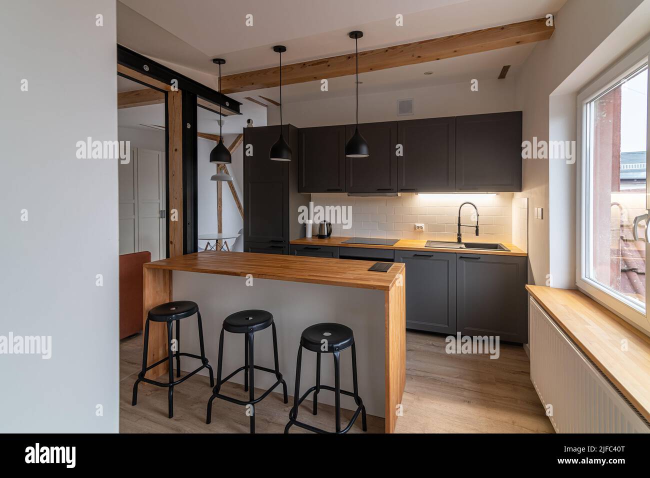 Dark gray kitchen furniture in a modern kitchen with a counter Stock Photo Alamy