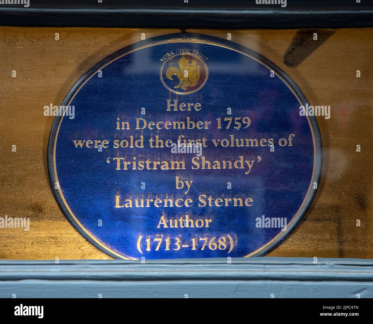 York, UK - June 6th 2022: Plaque above a doorway on Stonegate in York ...