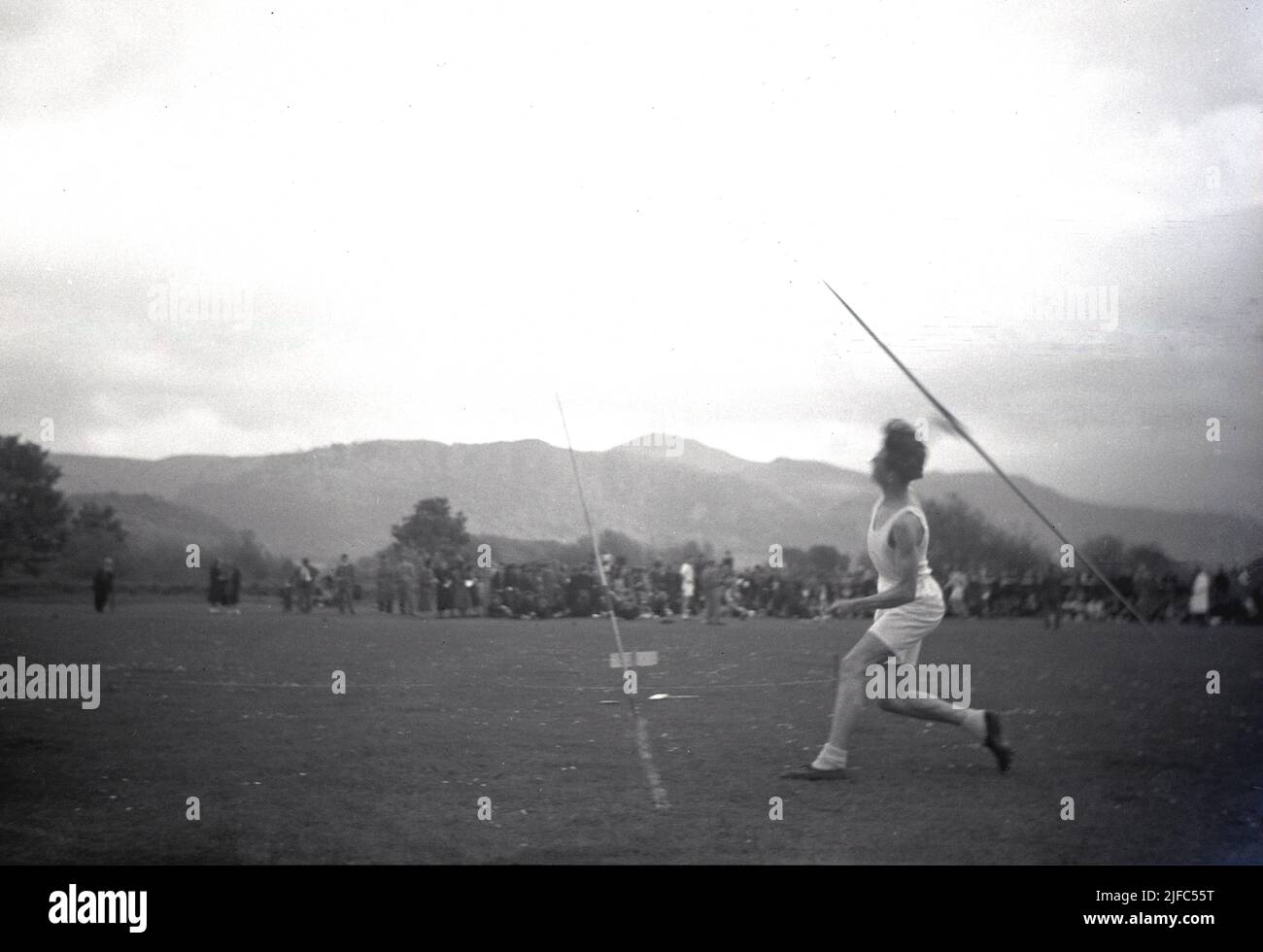 1954, historical, with the scottish mountains as the backdrop, outside